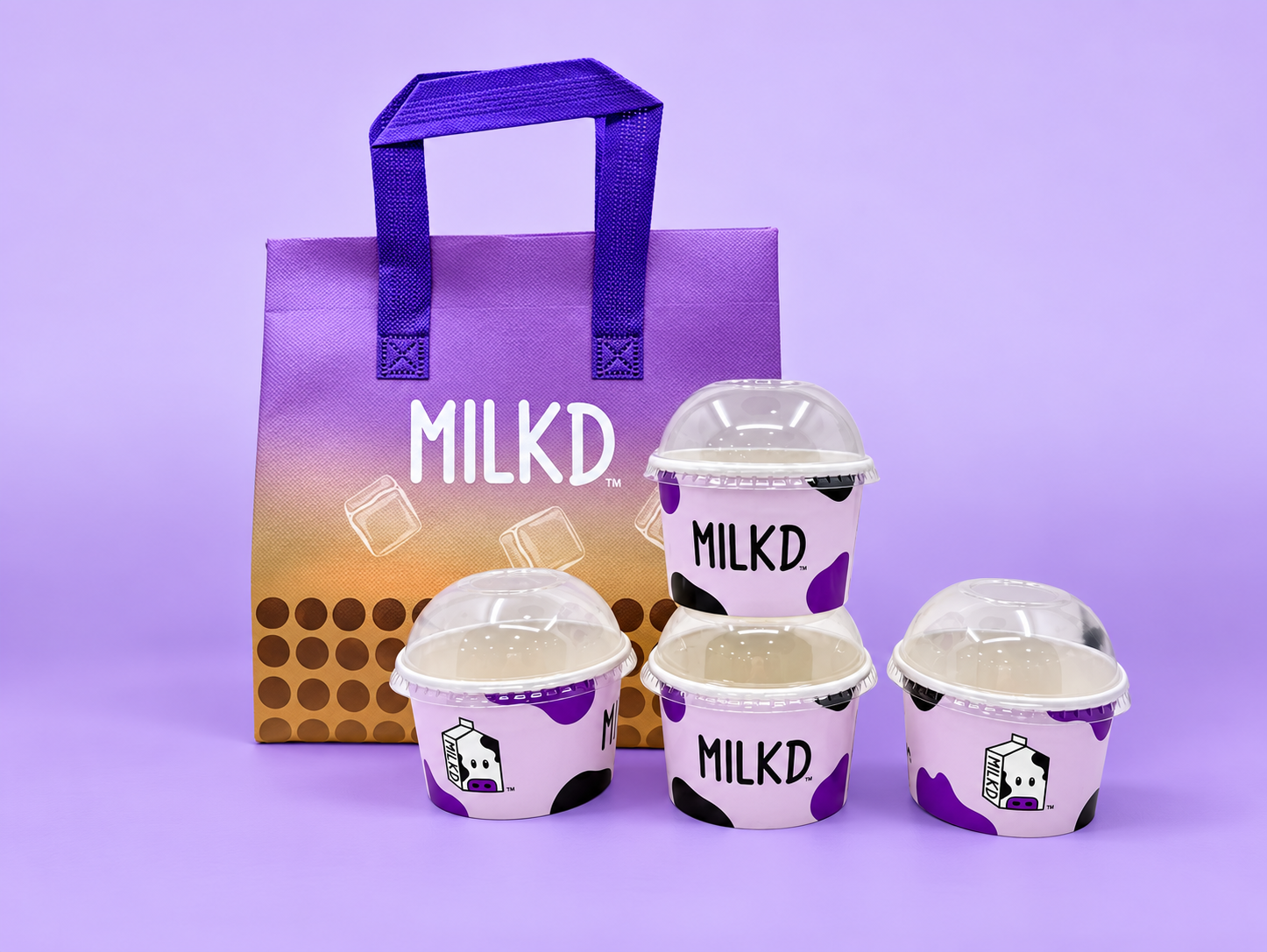 MILKD purple branded carry bag and takeaway cups